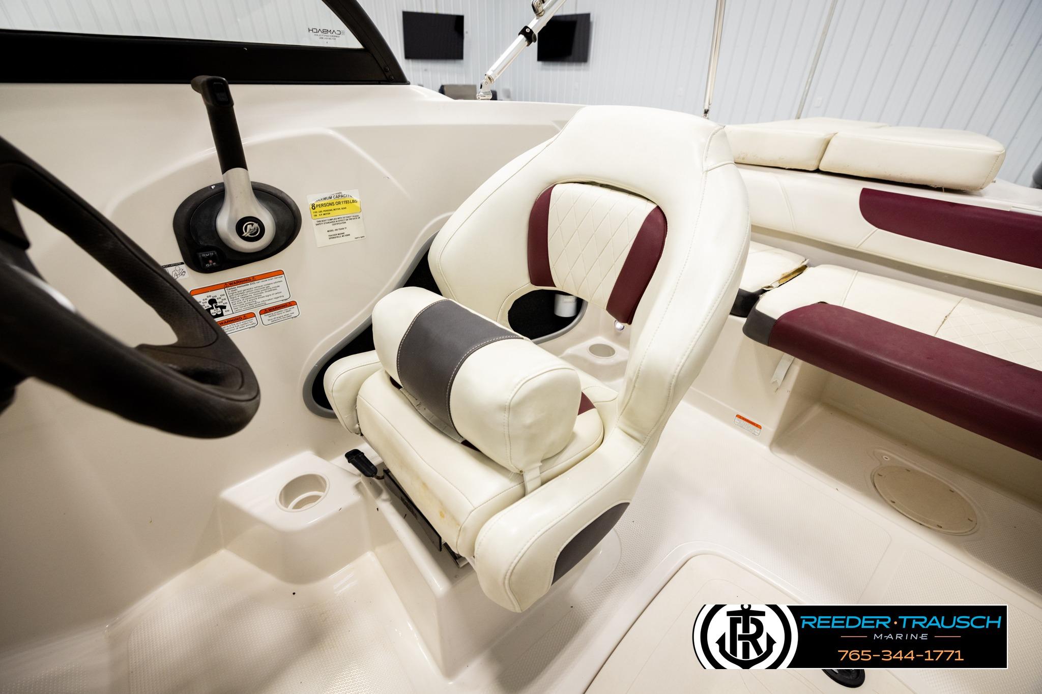 Interior of a 2016 Tahoe 450 TS boat with white and maroon seating.