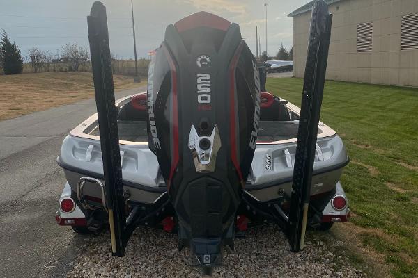 2015 Ranger Z520C boat with Evinrude engine, parked outdoors.