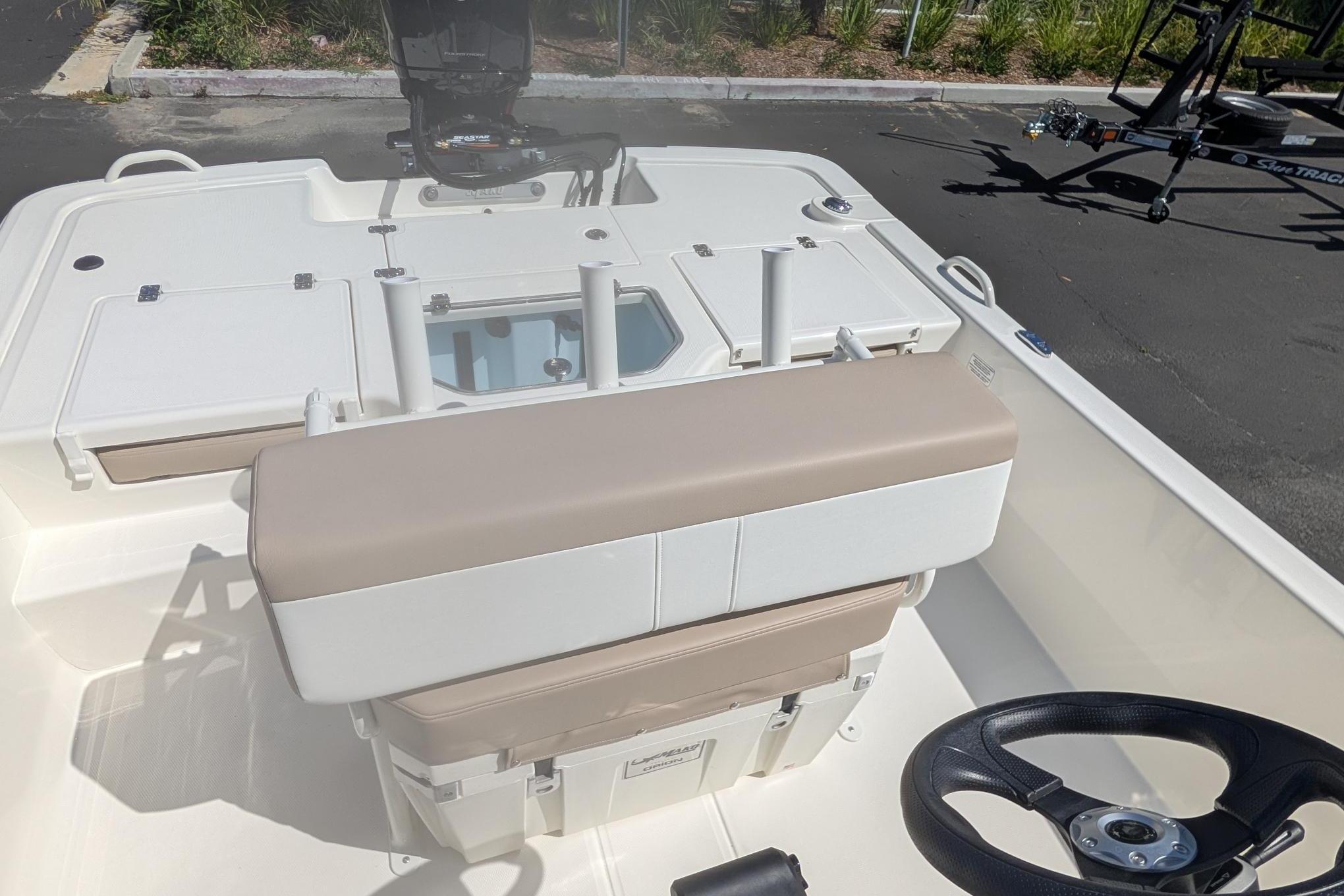 2026 Mako Pro Skiff 19 CC boat interior with steering wheel and seating.