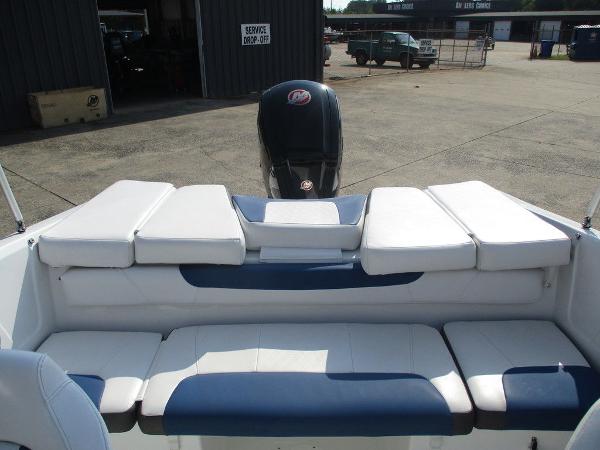 2023 Tahoe 185 S boat interior with cushioned seating and outboard motor.