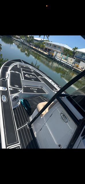 2020 Sportsman Masters 247 Bay Boat on calm water.