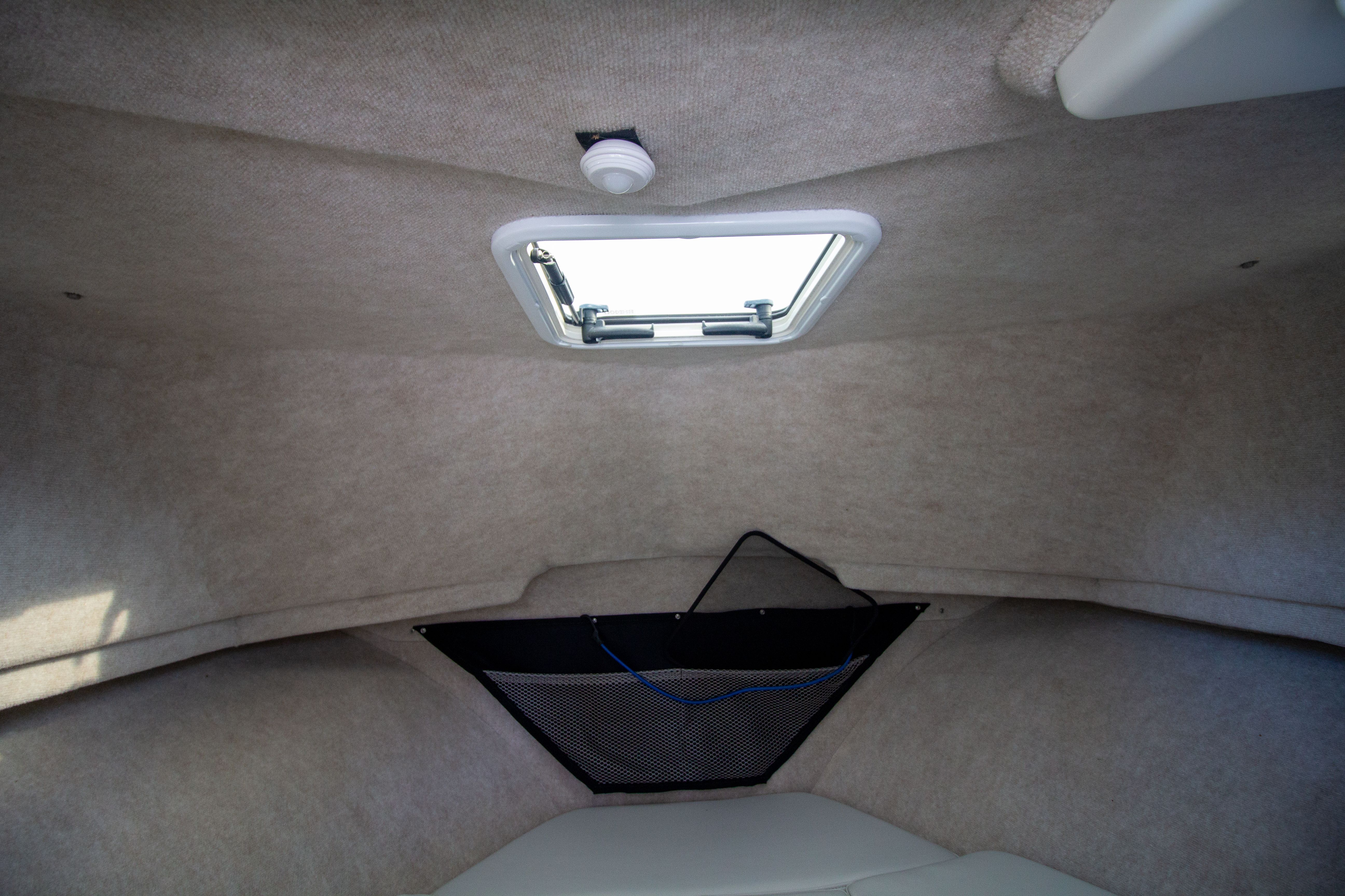 Interior of 2022 Parker 2520 XLD Sport Cabin with skylight.