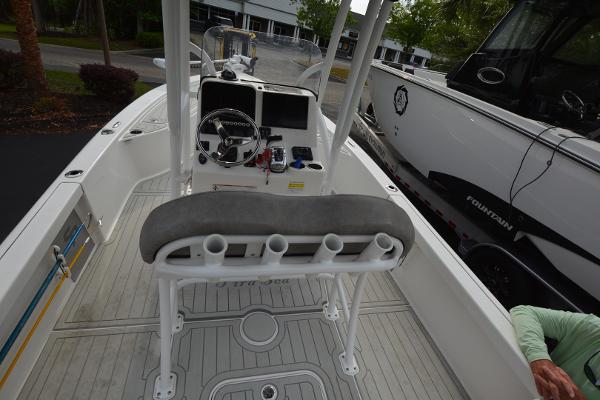 2021 Sea Pro 228 Bay boat interior with steering console and seating.