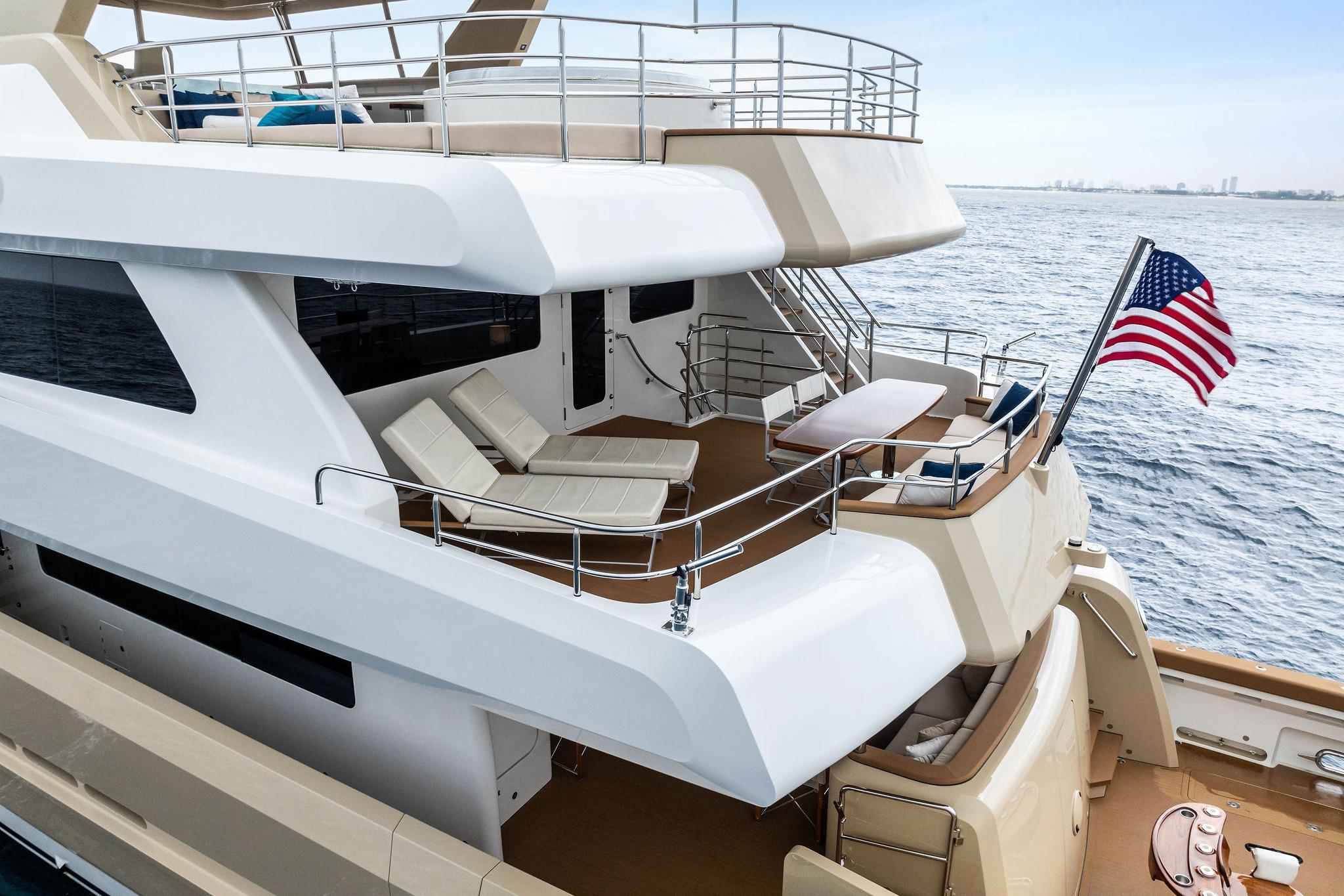 Bridge Afterdeck with chaise loungers, aft settee, table