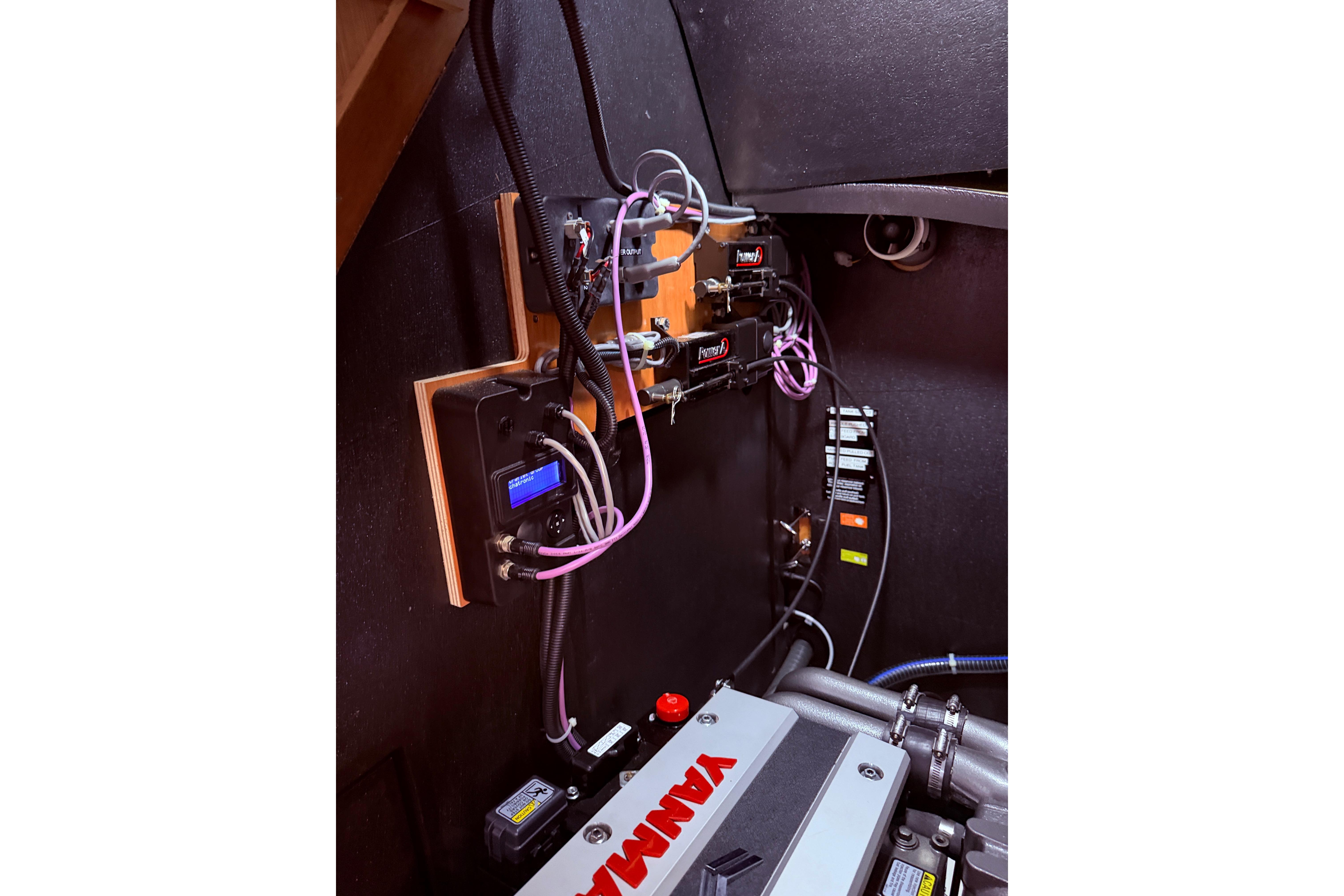 Engine room of 2022 Beneteau Oceanis Yacht 54 with Yanmar components and wiring.