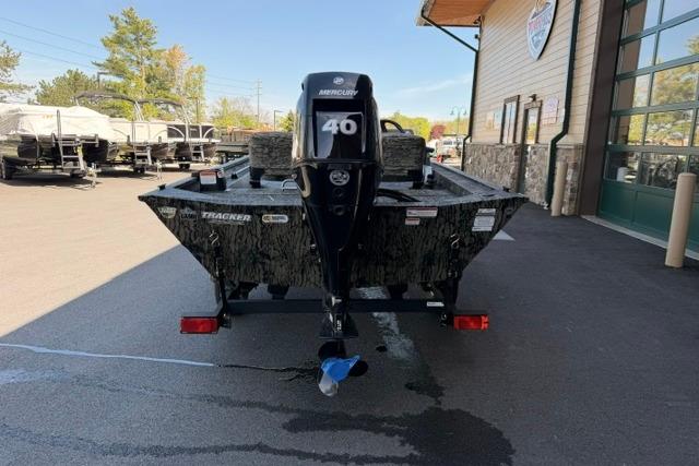 2026 Tracker Grizzly 1754 SC boat with Mercury 40 engine, parked outdoors.