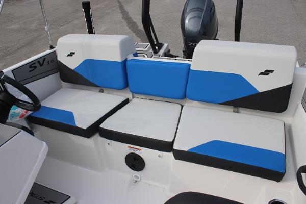 2025 Starcraft SV 16 OB boat interior with blue and white seating.