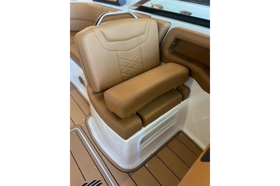 Luxurious tan seating in 2025 Chaparral 247 SSX boat interior.