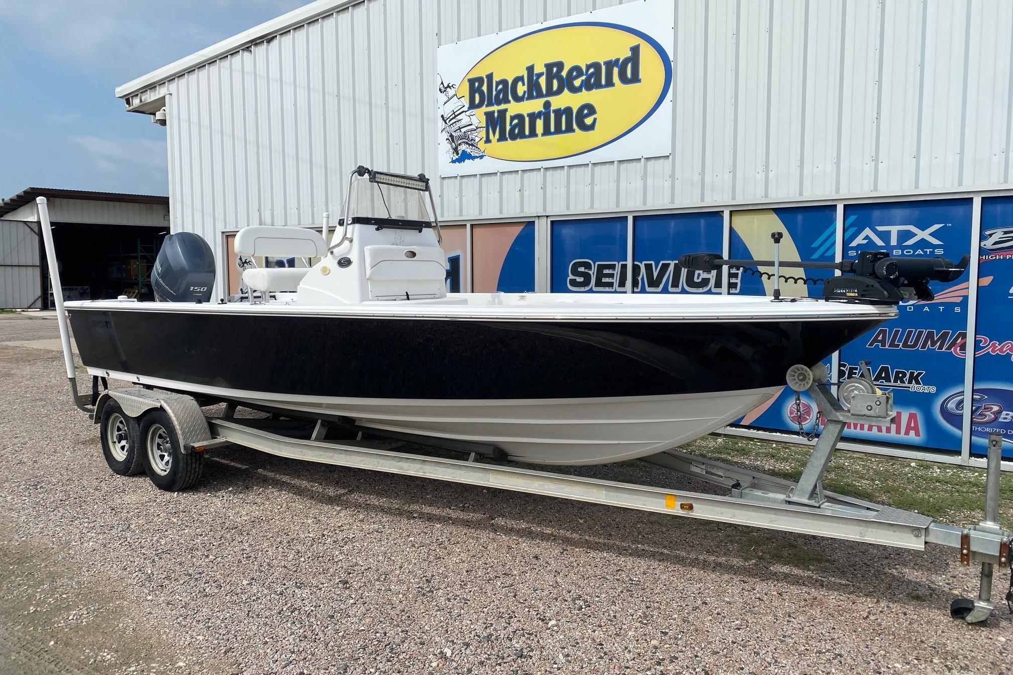 2013 Sportsman Masters 227 Bay Boat on trailer at BlackBeard Marine dealership.