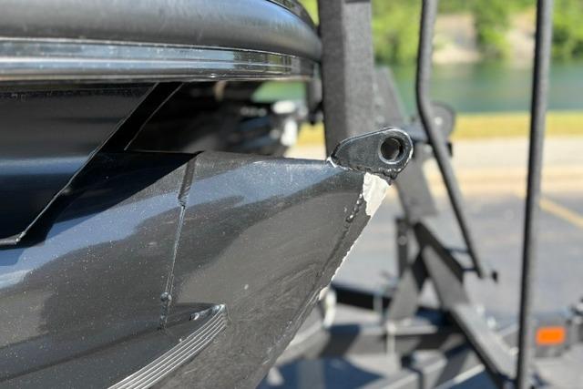 Close-up of a 2025 Regency 250 DL3 boat hull on a trailer.