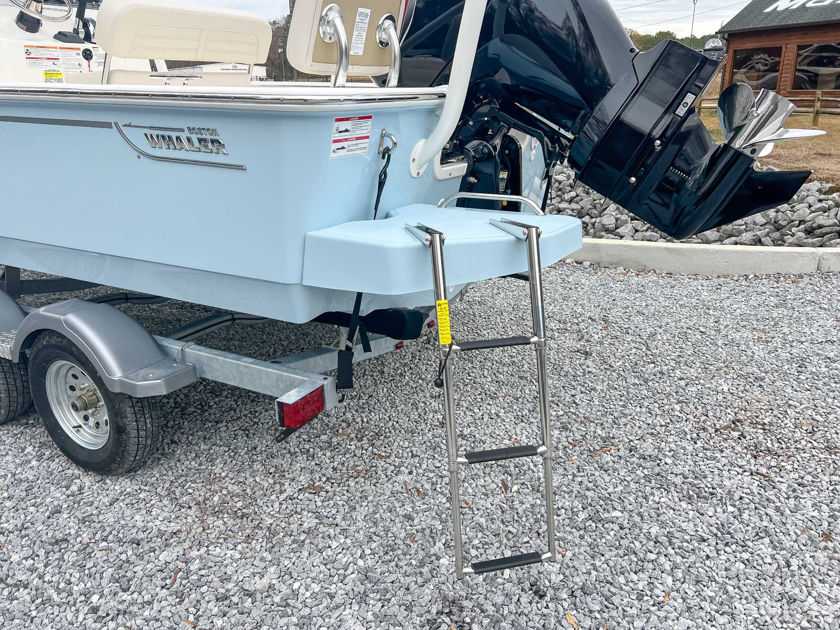 2025 Boston Whaler 190 Montauk with outboard motor and ladder.