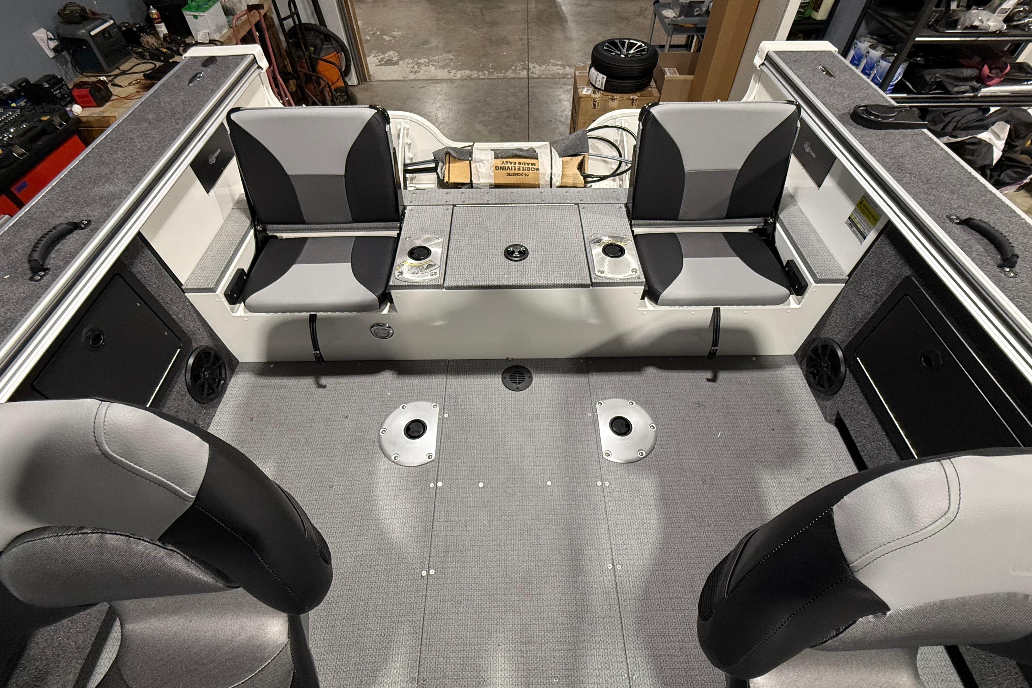 2025 G3 Angler V1850 SF boat interior with gray seating and storage compartments.
