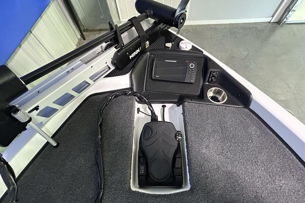 2026 Phoenix 818 Pro boat dashboard with navigation system and foot pedal controls.