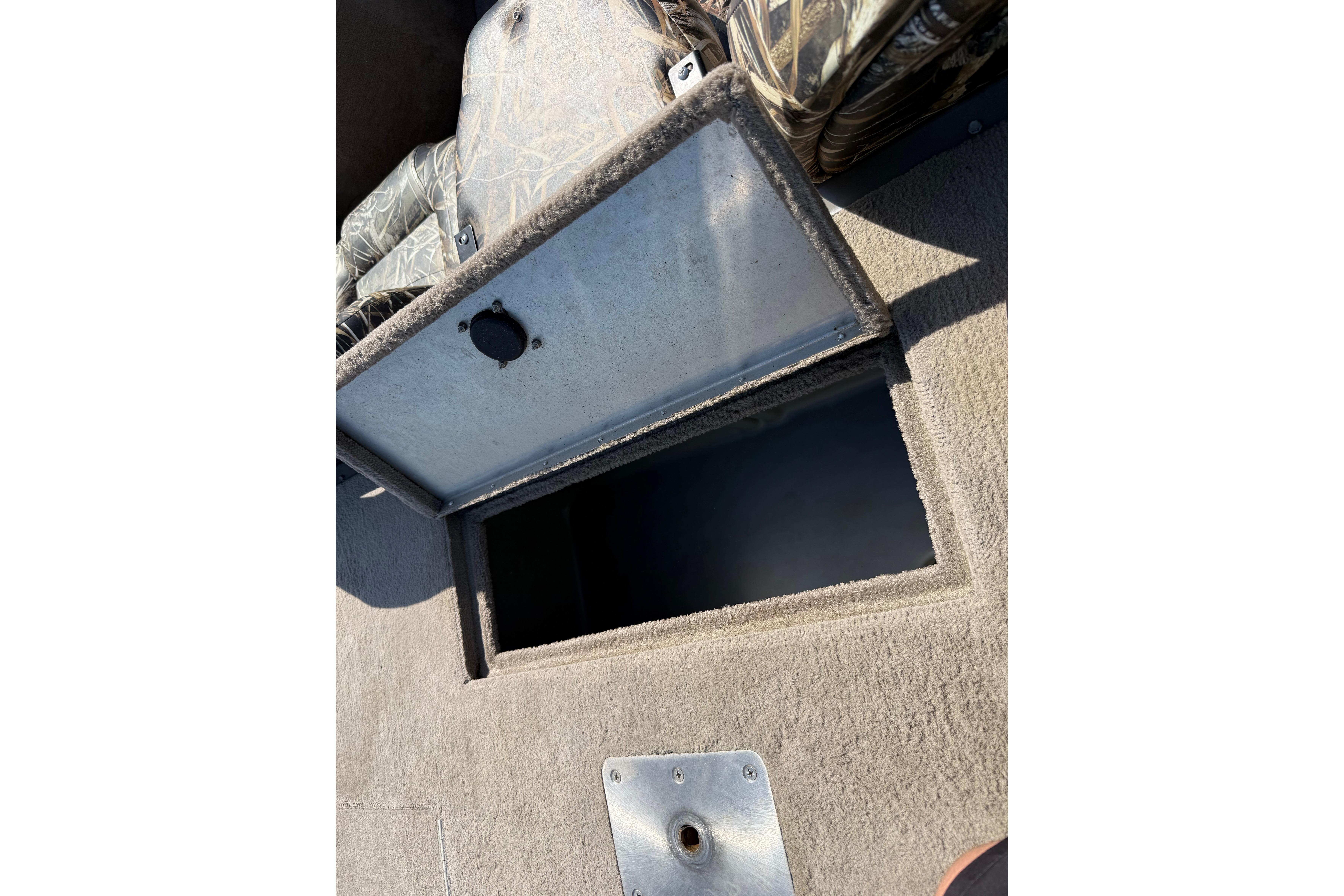 Open storage compartment on 2010 SeaArk Stealth 190 boat.