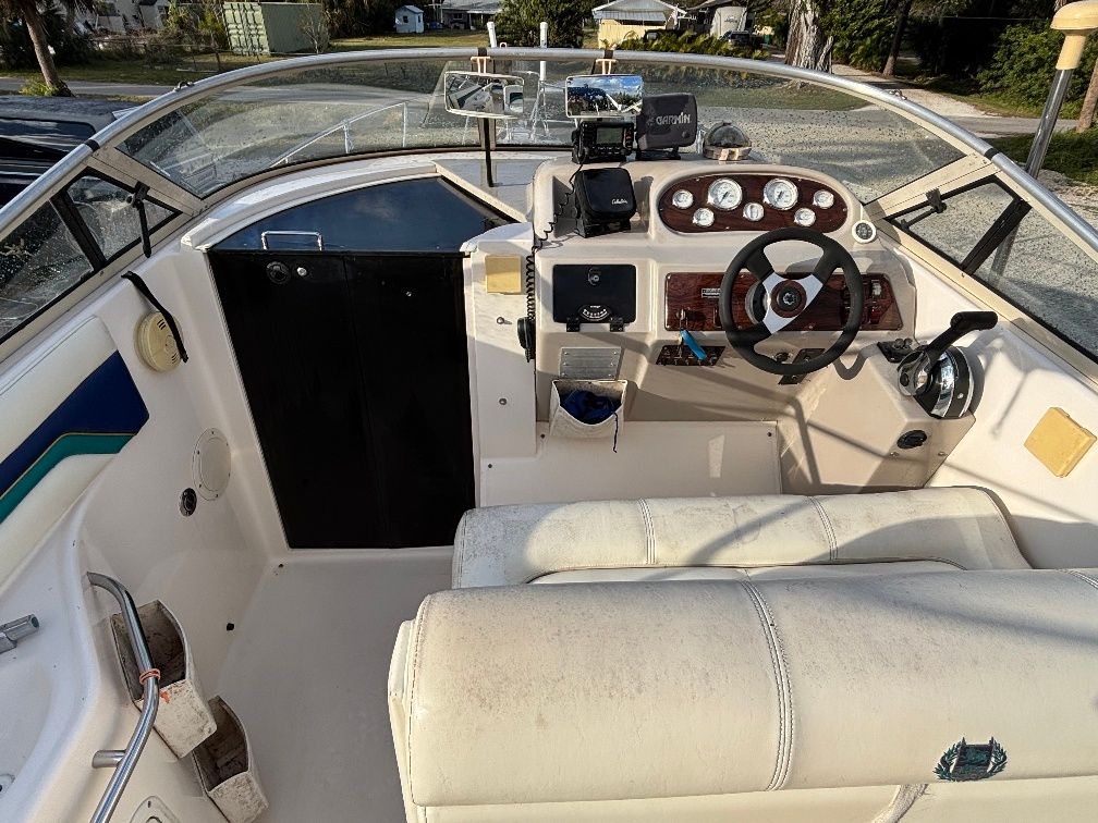 Interior of a 1997 Donzi 275LXC boat with helm console.