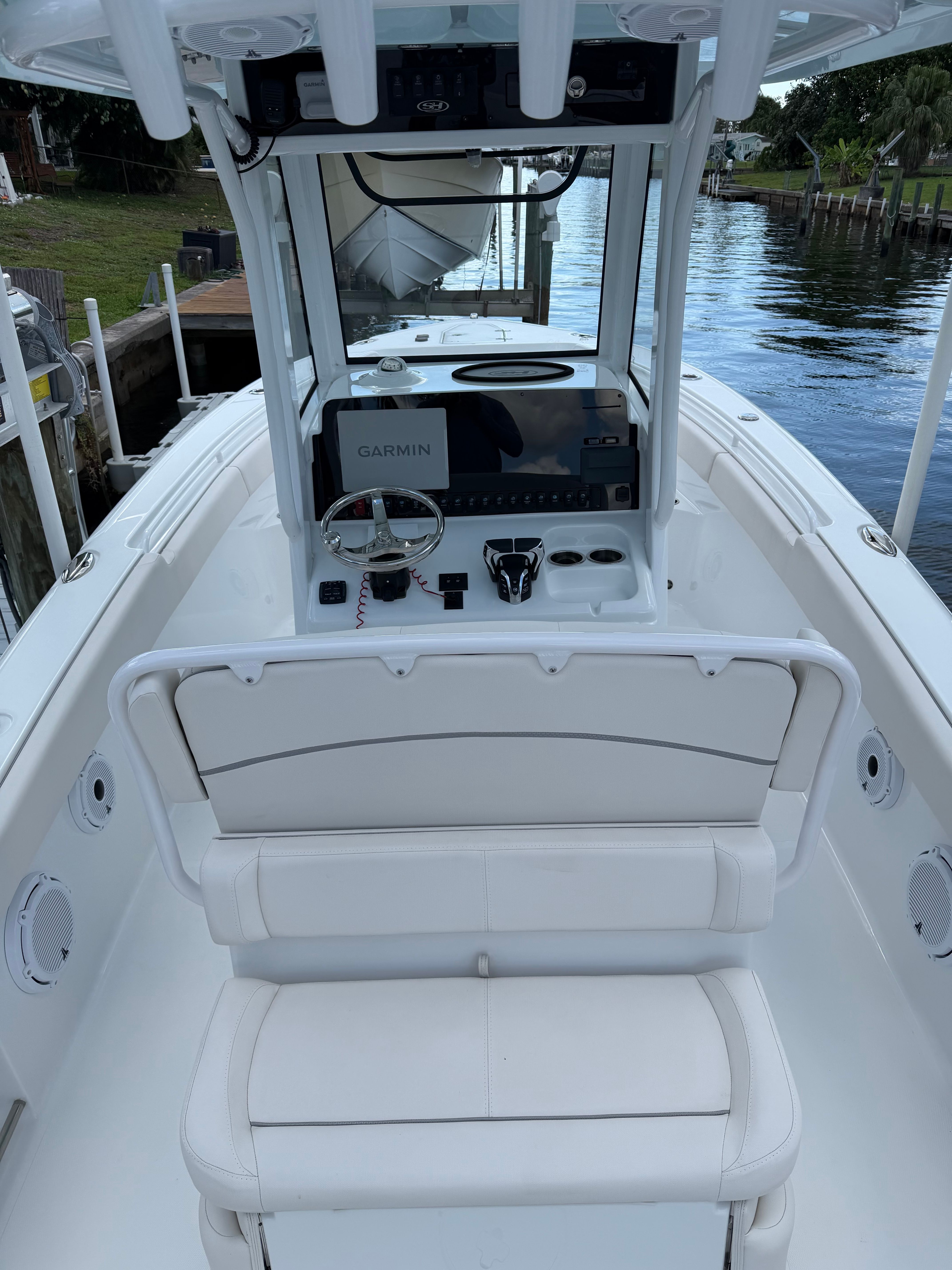 The image shows the cockpit of a 2024 Sea Hunt Ultra 265 SE boat.