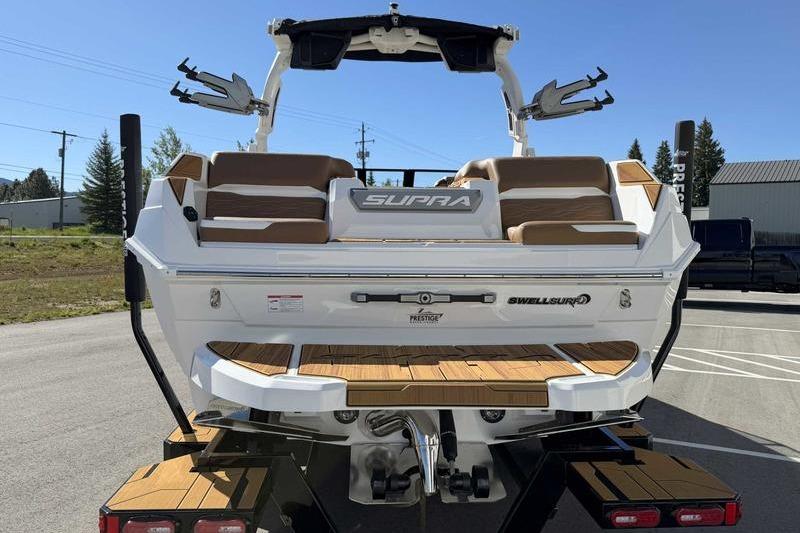 2026 Supra SL boat rear view with seating and Swell Surf system.