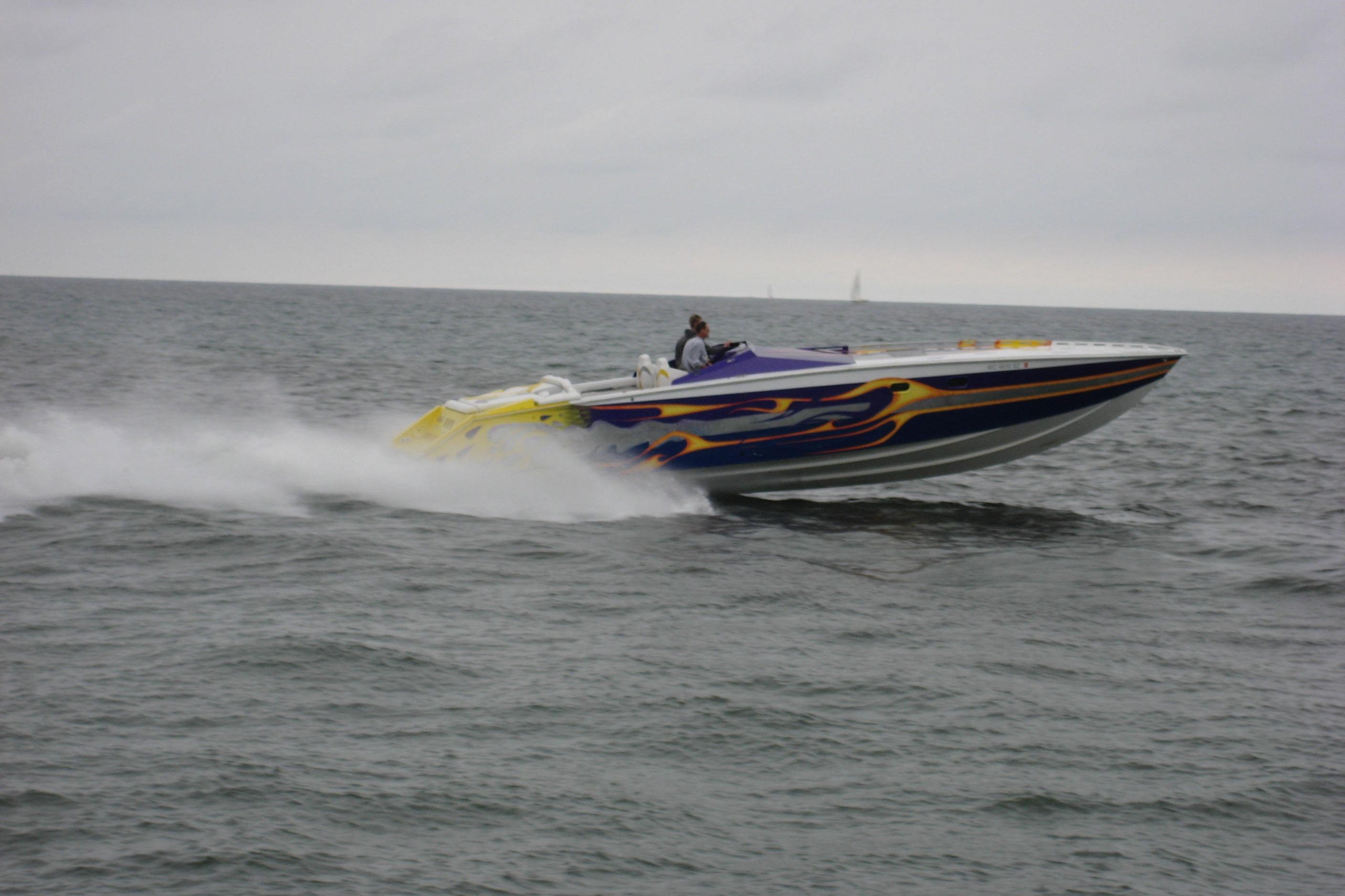 High-speed Python Offshore boat from 2000 racing on open water.