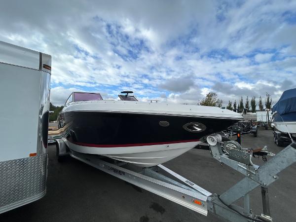 2010 Cobalt 262 boat on trailer under cloudy sky.