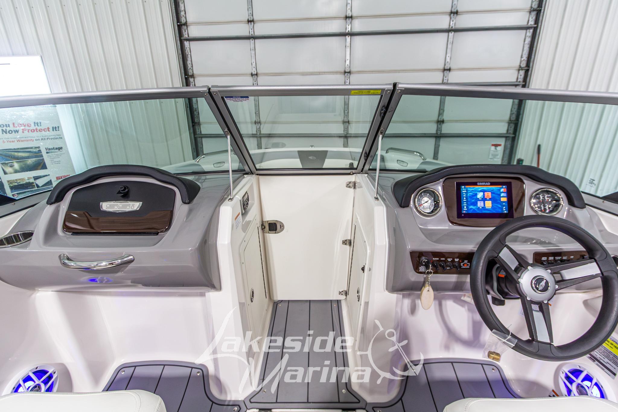 2022 Chaparral 21 SSi boat dashboard with steering wheel and digital display at Lakeside Marina.