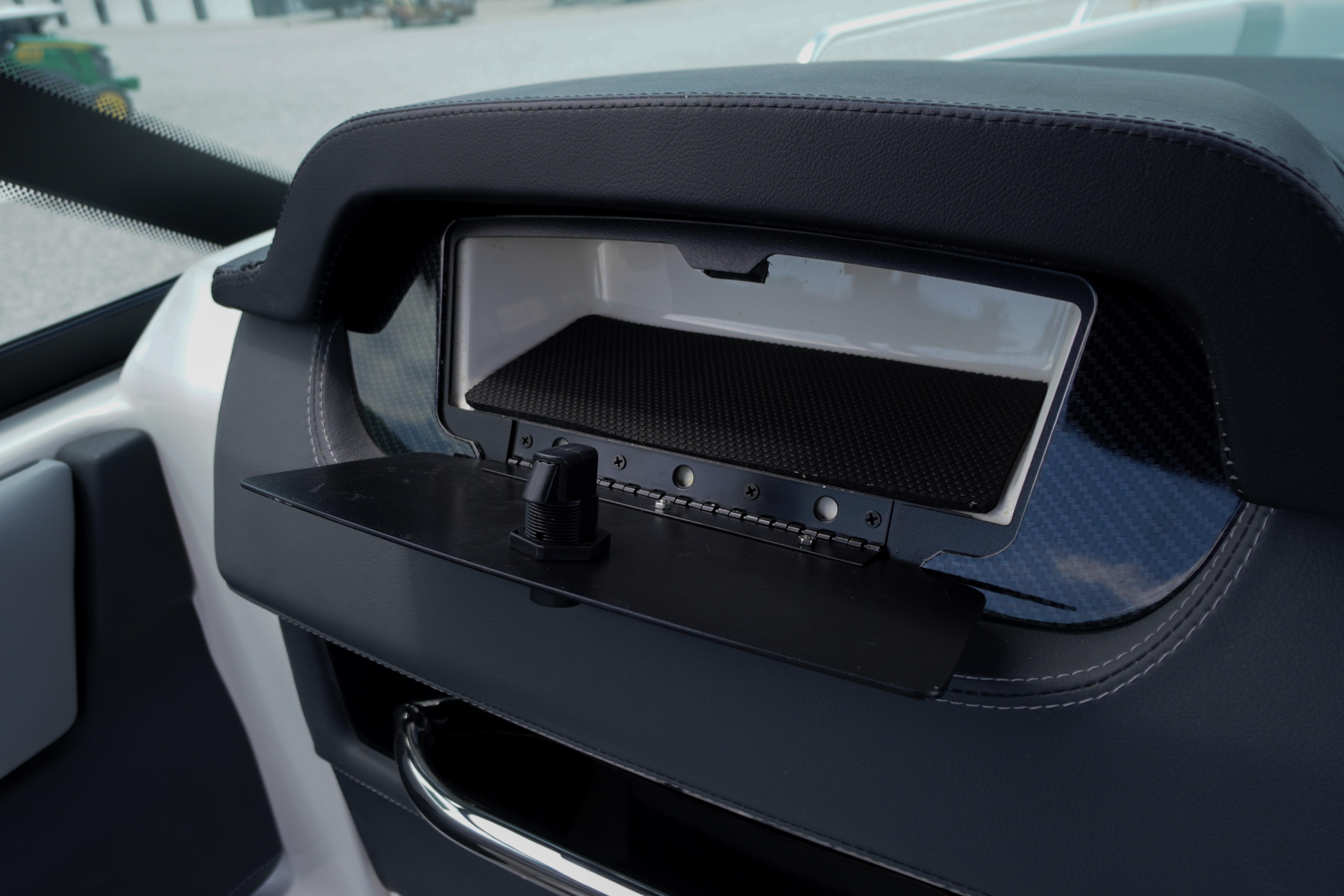 Dashboard compartment of 2026 Chaparral SSX 4 boat, featuring sleek design and storage space.
