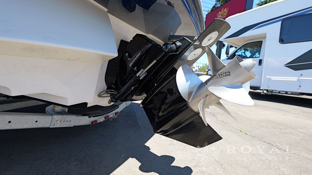 Rear view of a 2014 Sea Ray SLX 230 with dual propeller drive on a trailer.