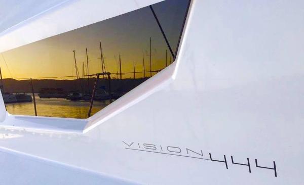 Vision 444 yacht reflecting sunset over marina, 2025 model.