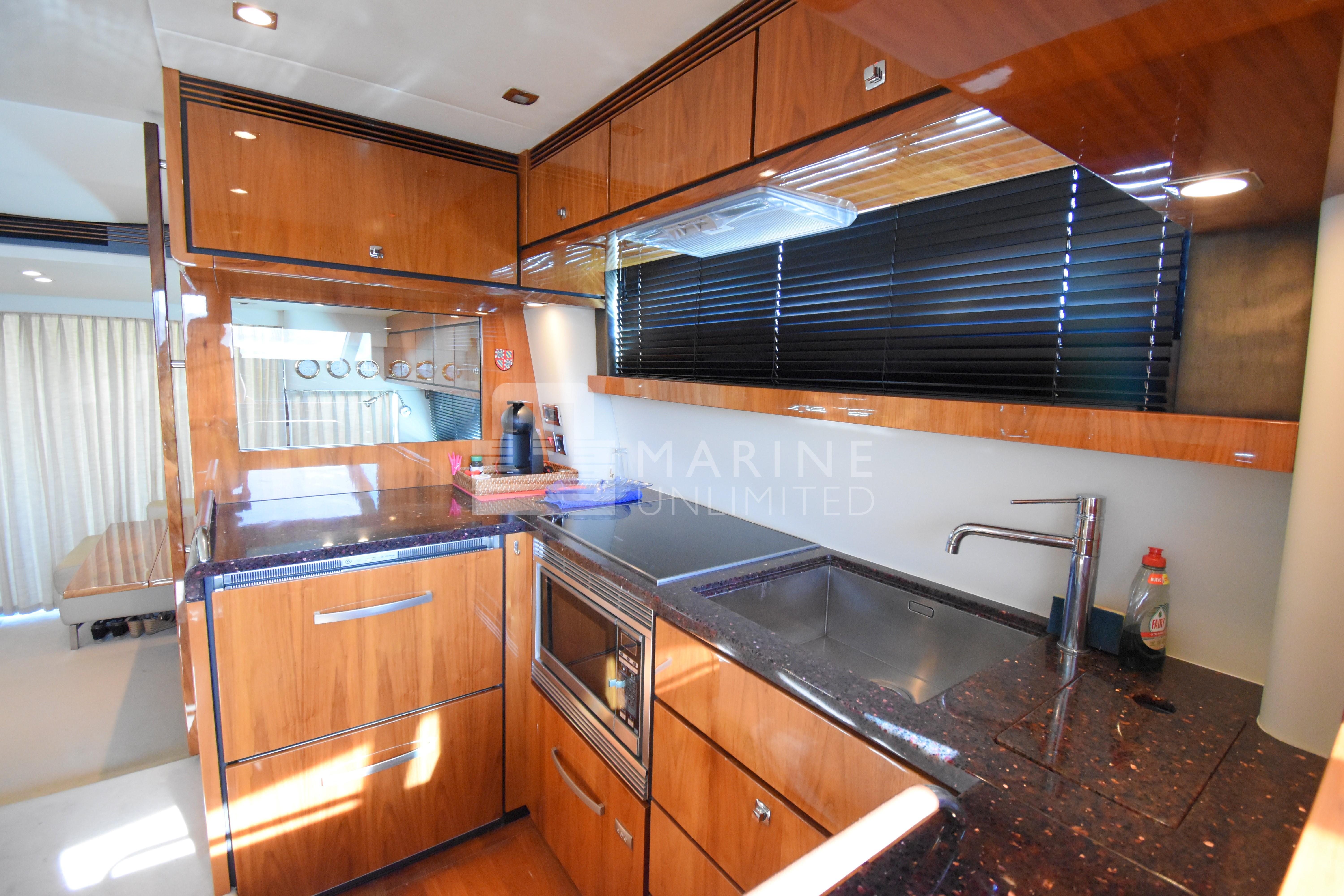 Luxurious kitchen interior of 2010 Fairline Squadron 55 yacht with modern amenities.