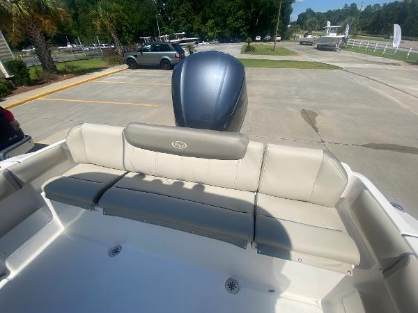 2024 Key West 239 FS boat with rear seating and outboard motor.
