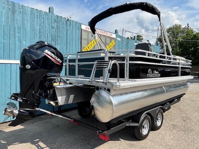 2026 Sun Tracker Fishin' Barge 20 DLX pontoon boat with Mercury outboard motor.