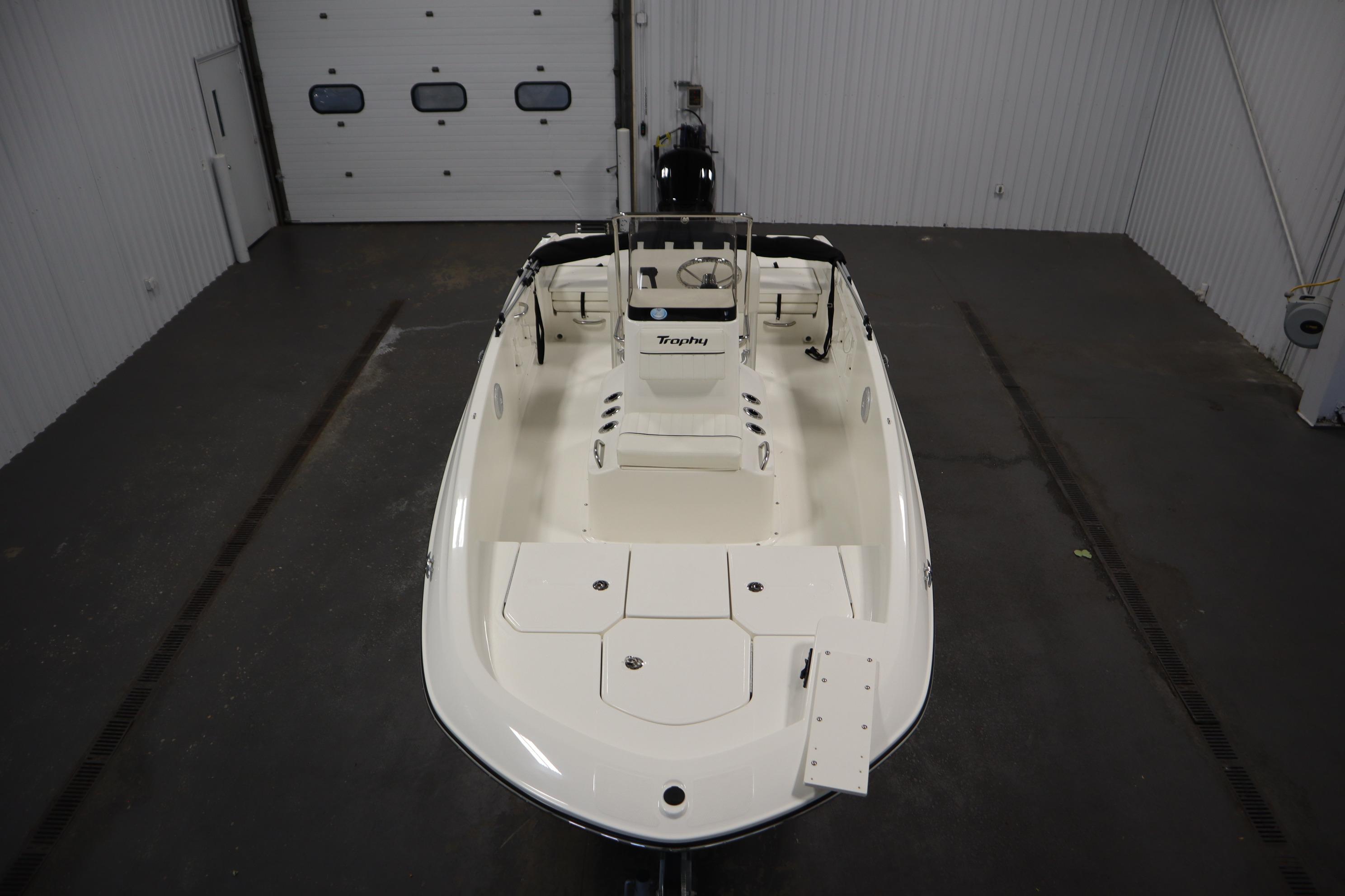 2026 Bayliner Trophy T18 boat in a spacious indoor garage setting.
