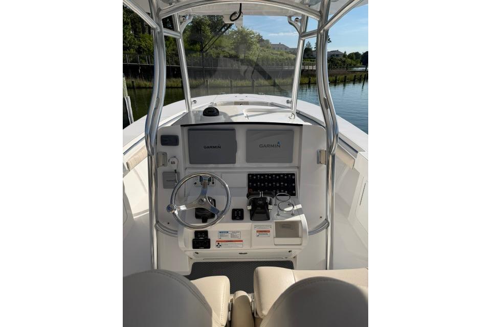 2014 Southport 29 FE boat helm with Garmin navigation system and steering wheel.