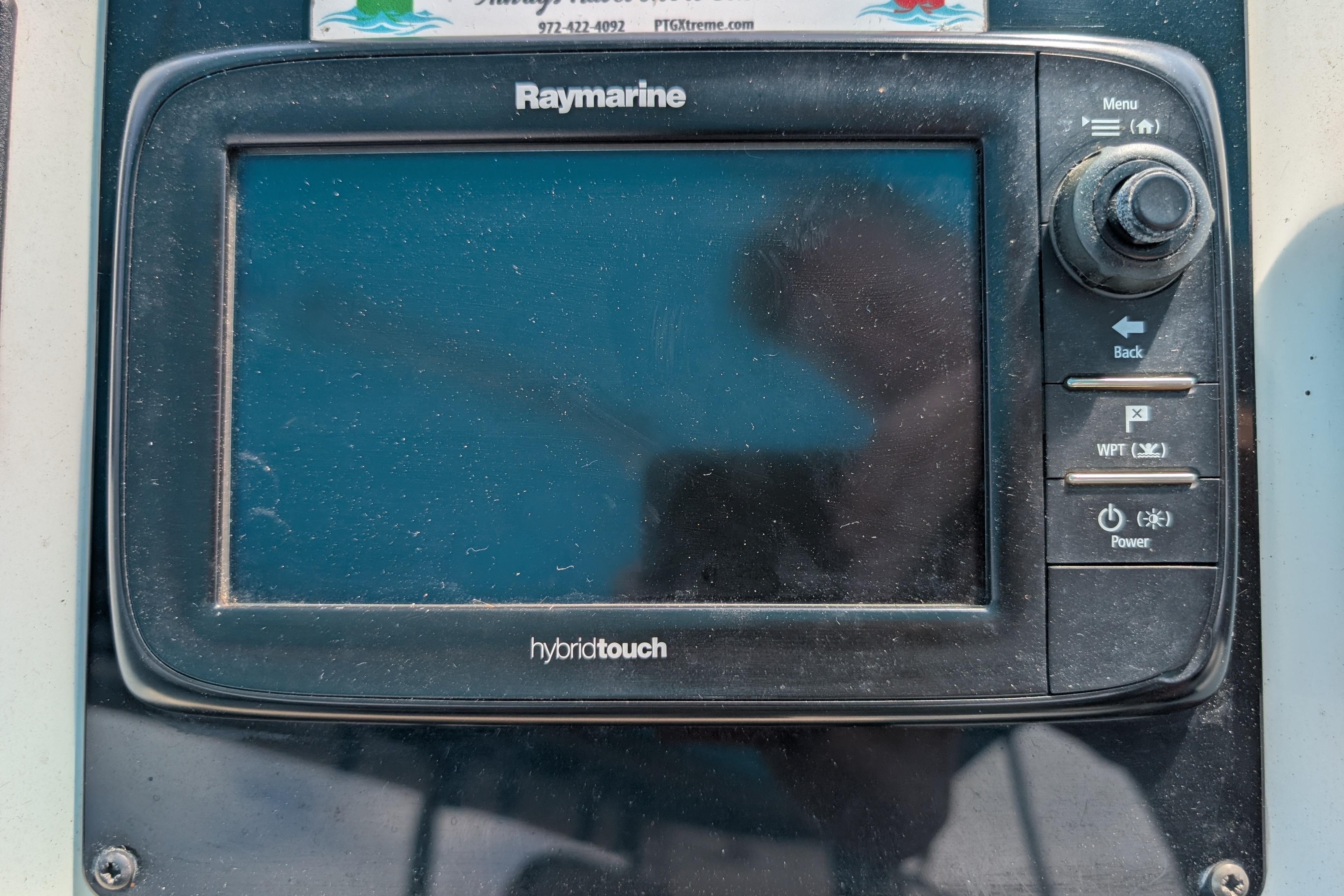 Raymarine HybridTouch display on 2004 PDQ 34 Powercat boat dashboard.