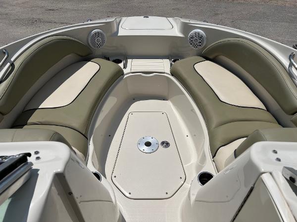 2005 Sea Ray 220 Sundeck boat interior with cushioned seating and speakers.