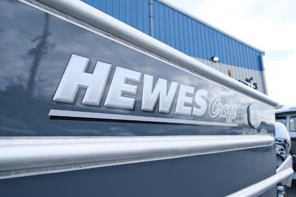 2024 Hewescraft 250 Explorer boat exterior with logo detail.