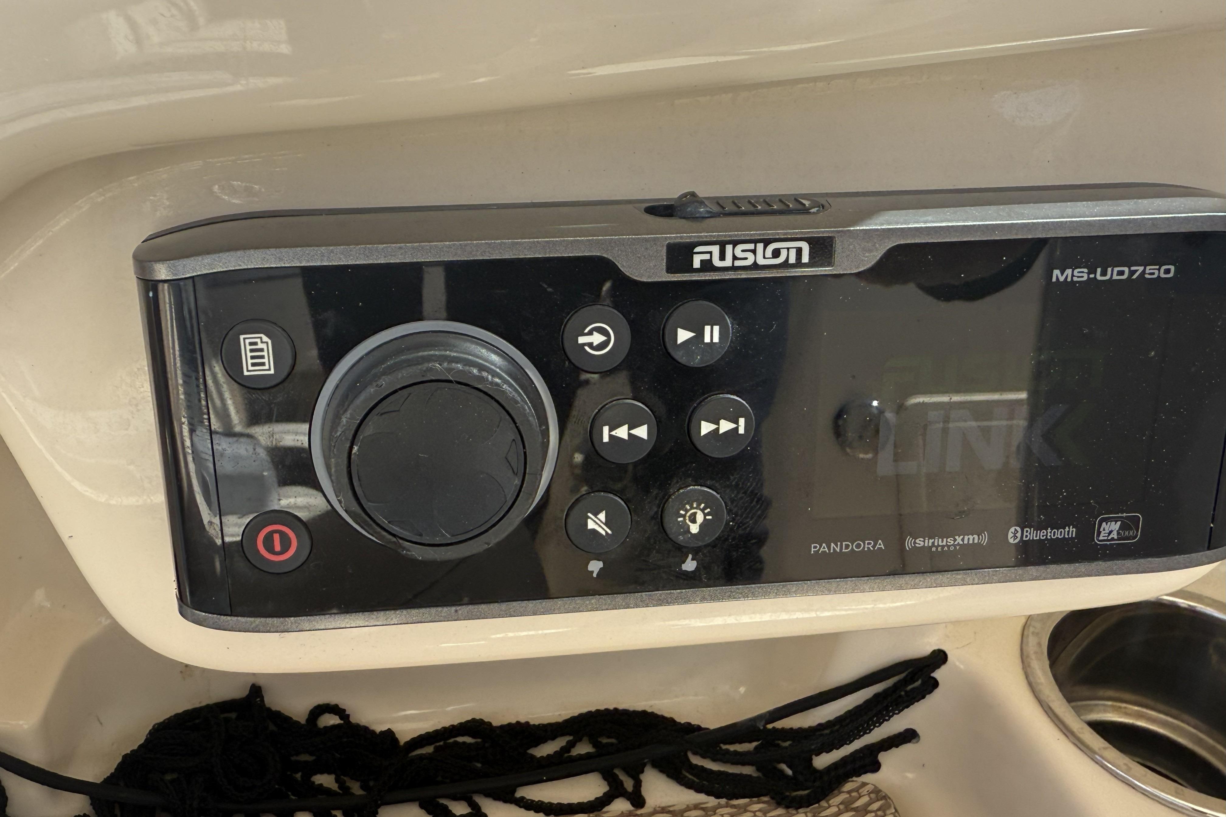 Fusion MS-UD750 audio system on 2014 Grady-White Freedom 275 boat dashboard.