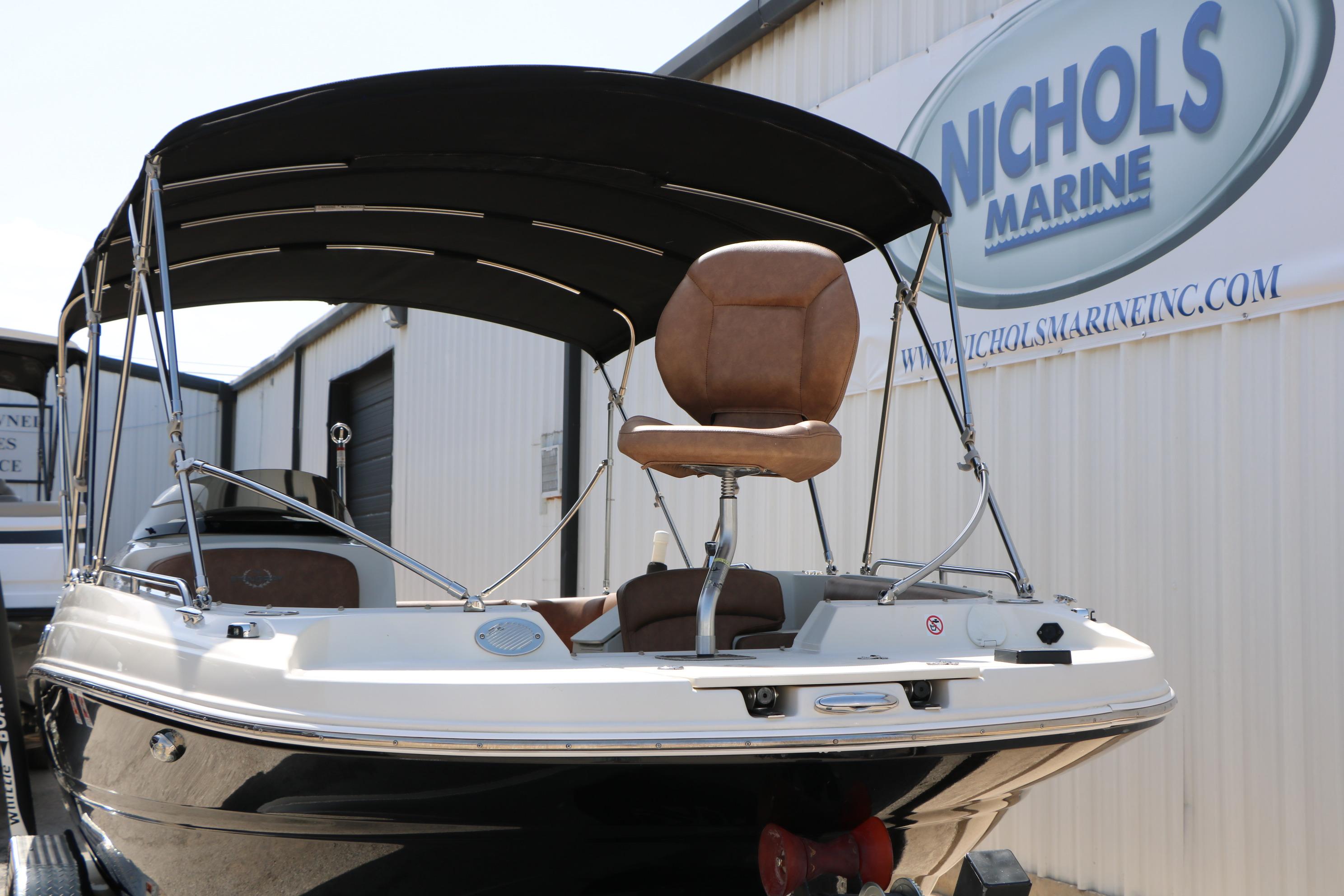 2022 Stingray 192 SC boat with canopy at Nichols Marine dealership.