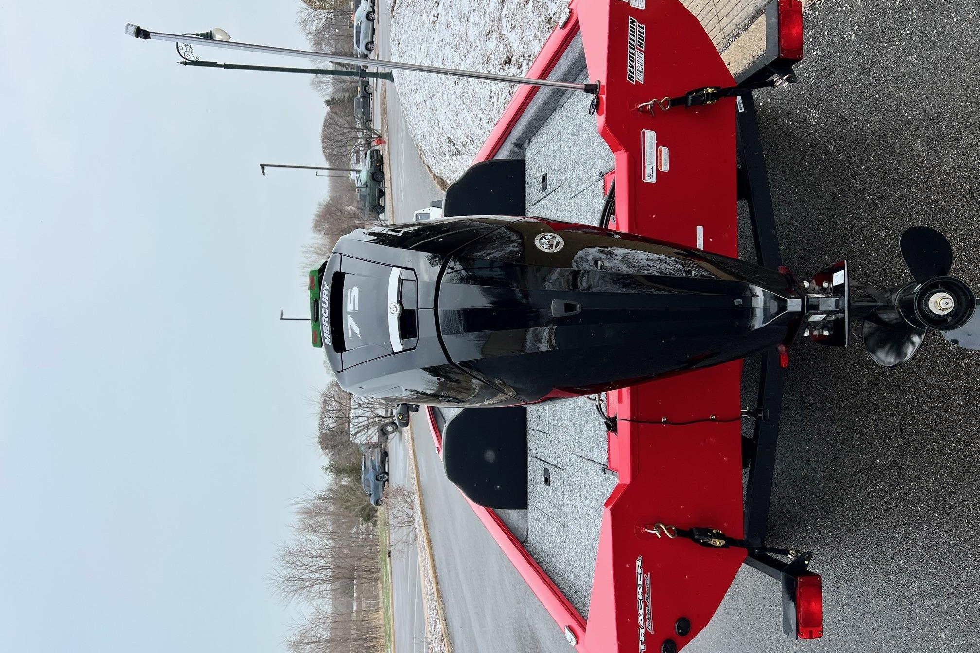 2026 Tracker Pro Team 175 boat on red trailer, rear view with Mercury engine.