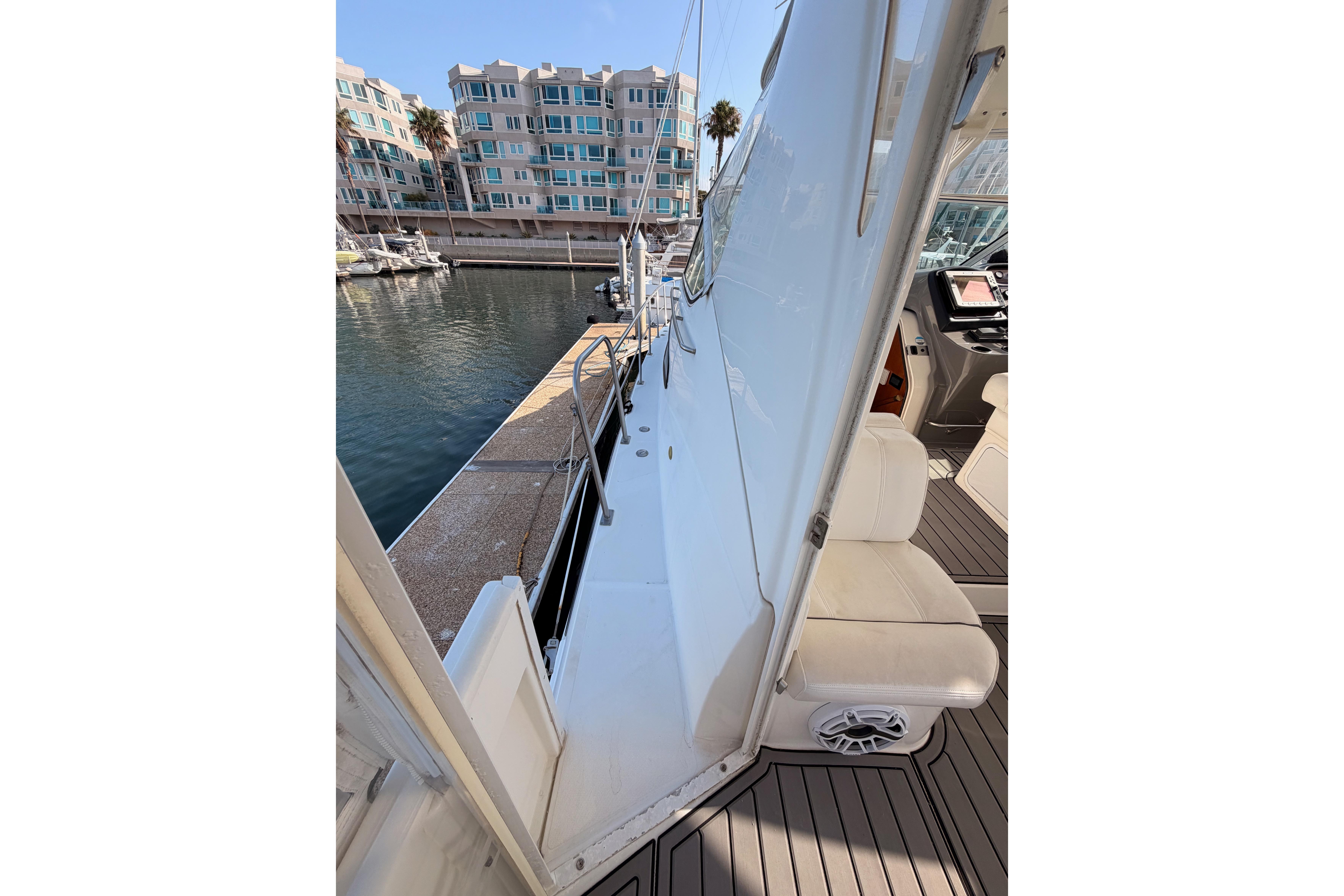 2005 Cruisers Yachts 405 Express Motoryacht docked, showcasing sleek design and luxurious seating.