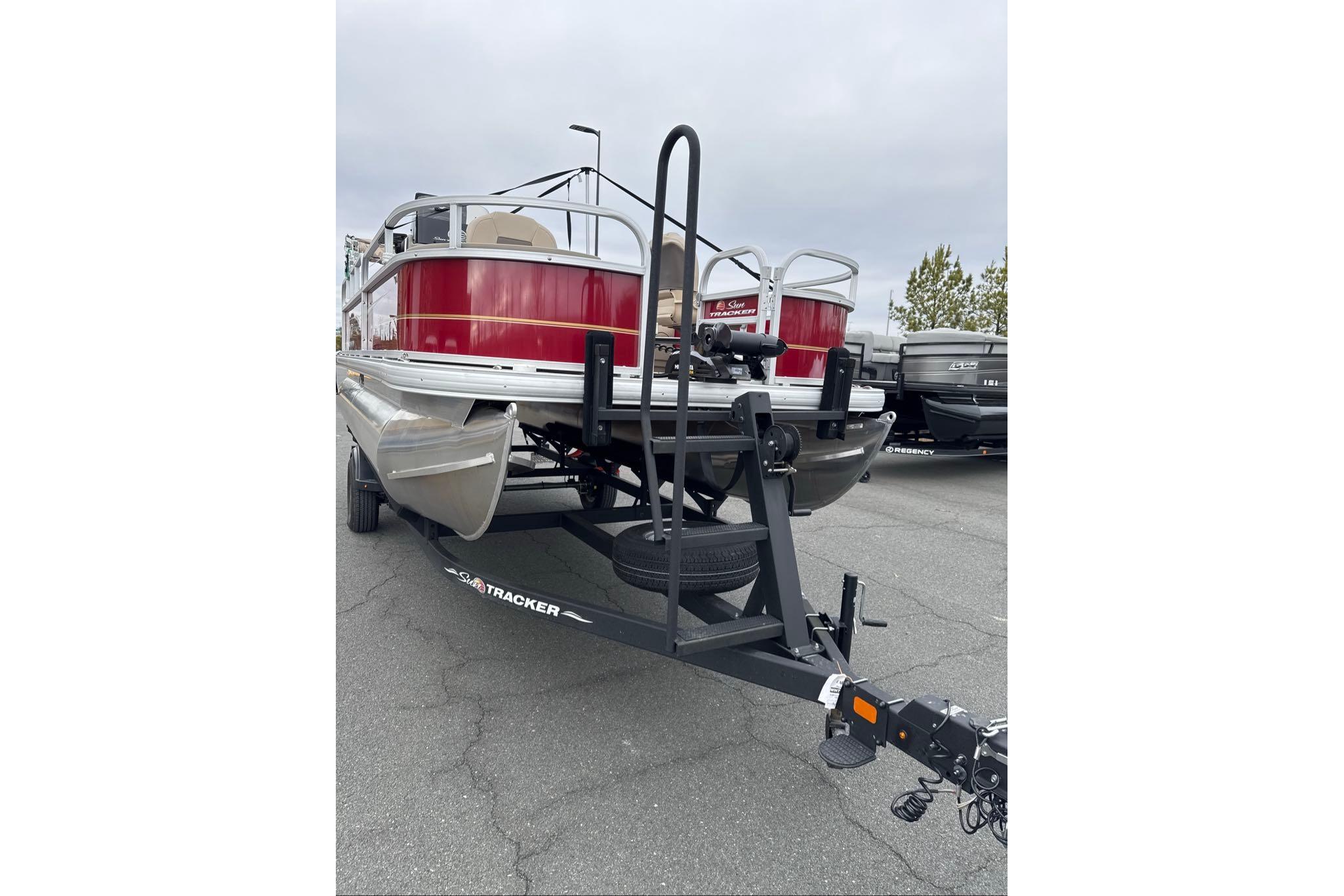 2024 Sun Tracker Bass Buggy 18 DLX pontoon boat on trailer, rear view.