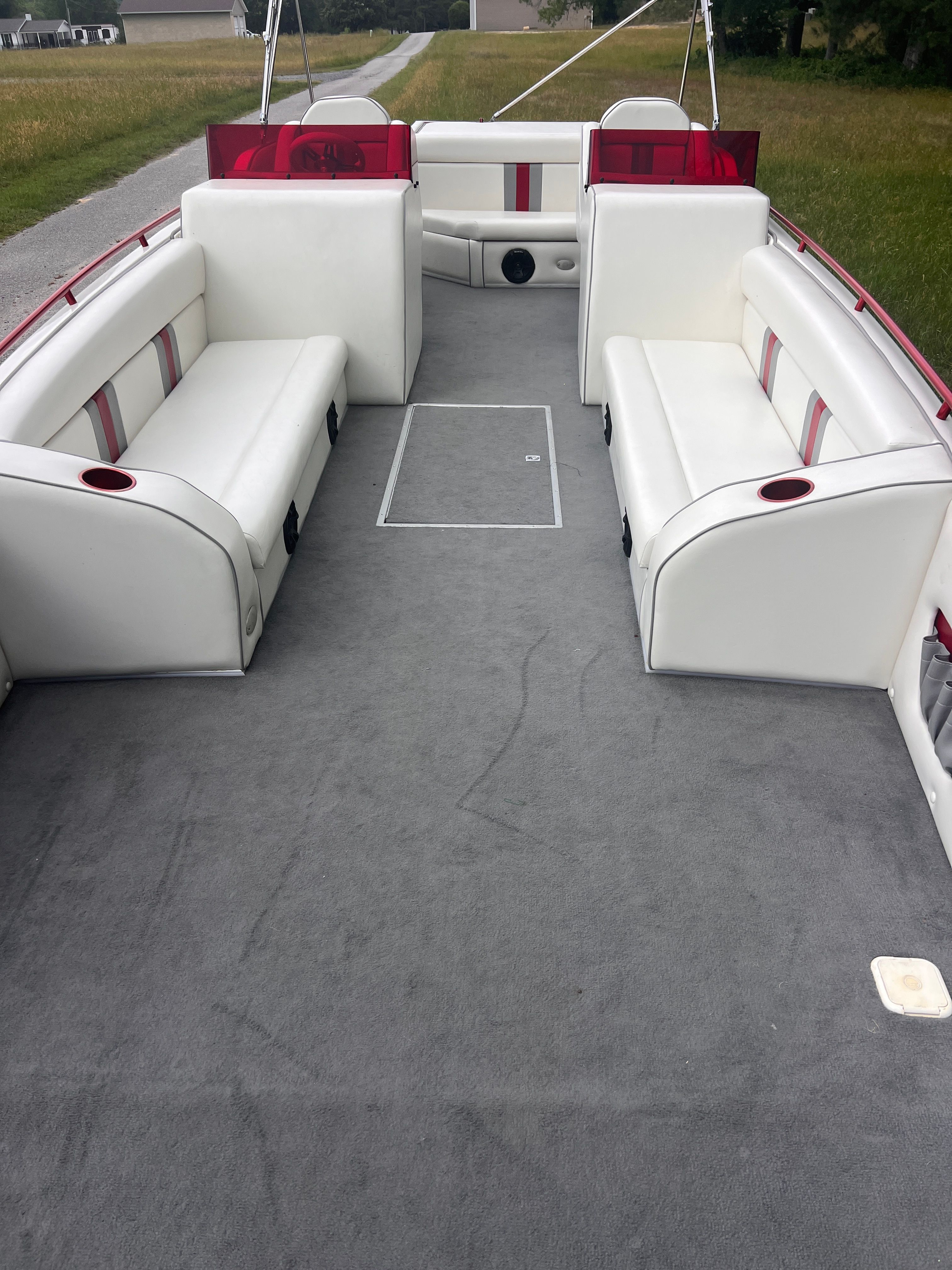 Interior of a 2008 Cheetah Fastcat with white seating and gray carpeted floor.