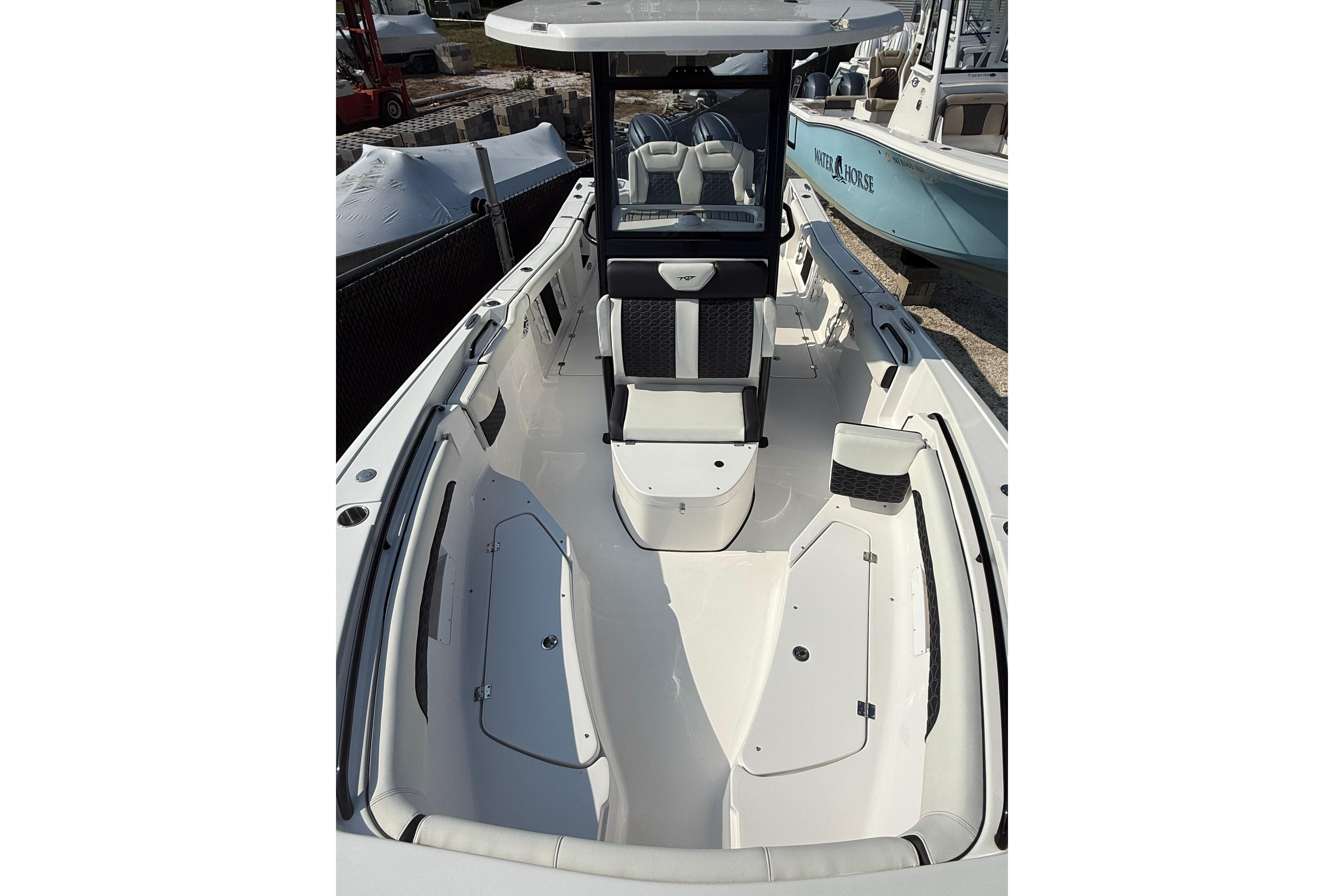 2026 Tidewater 256 CC Adventure boat interior with seating and storage compartments.