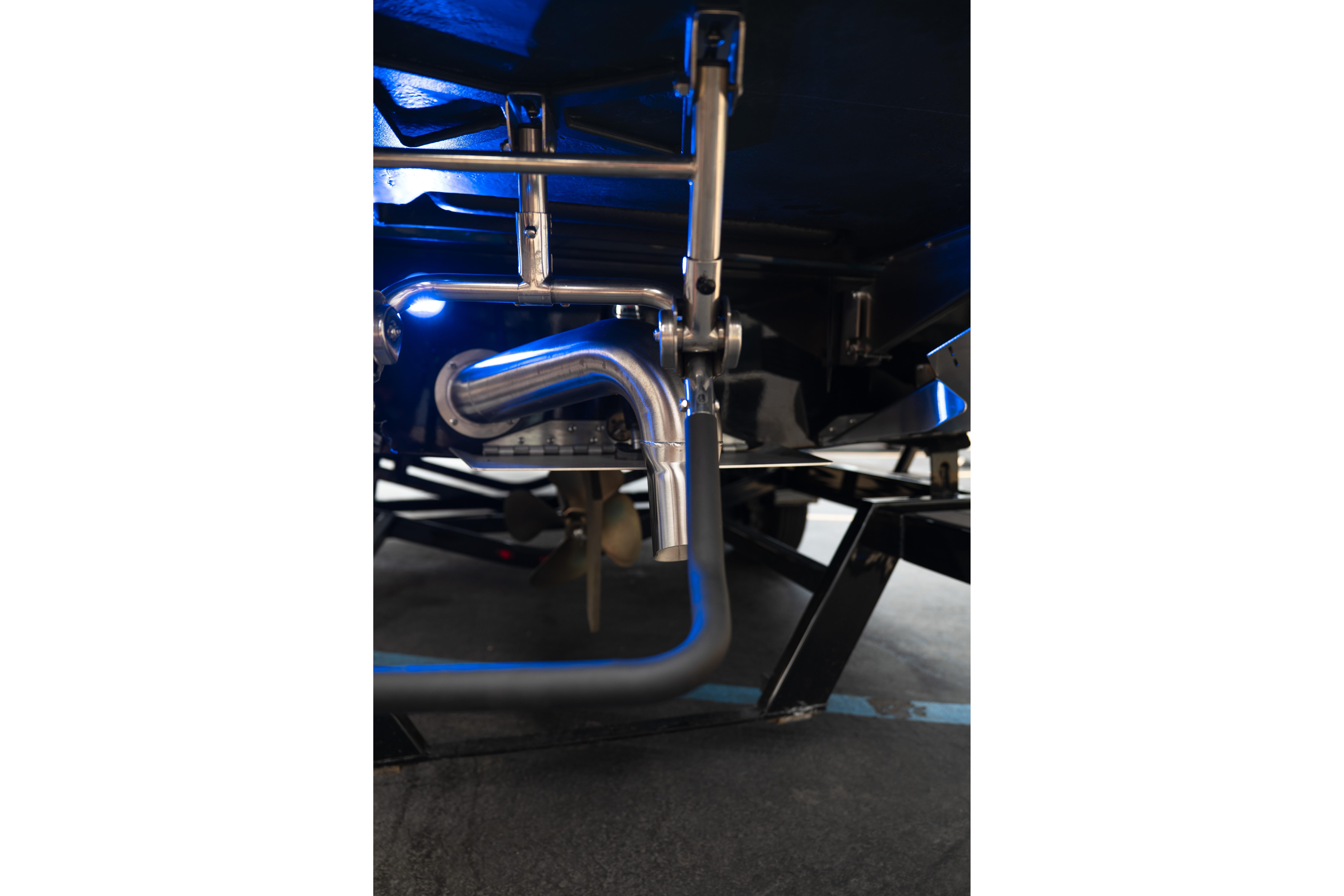 2024 Tigé Z5 boat underside with stainless steel exhaust and propeller.
