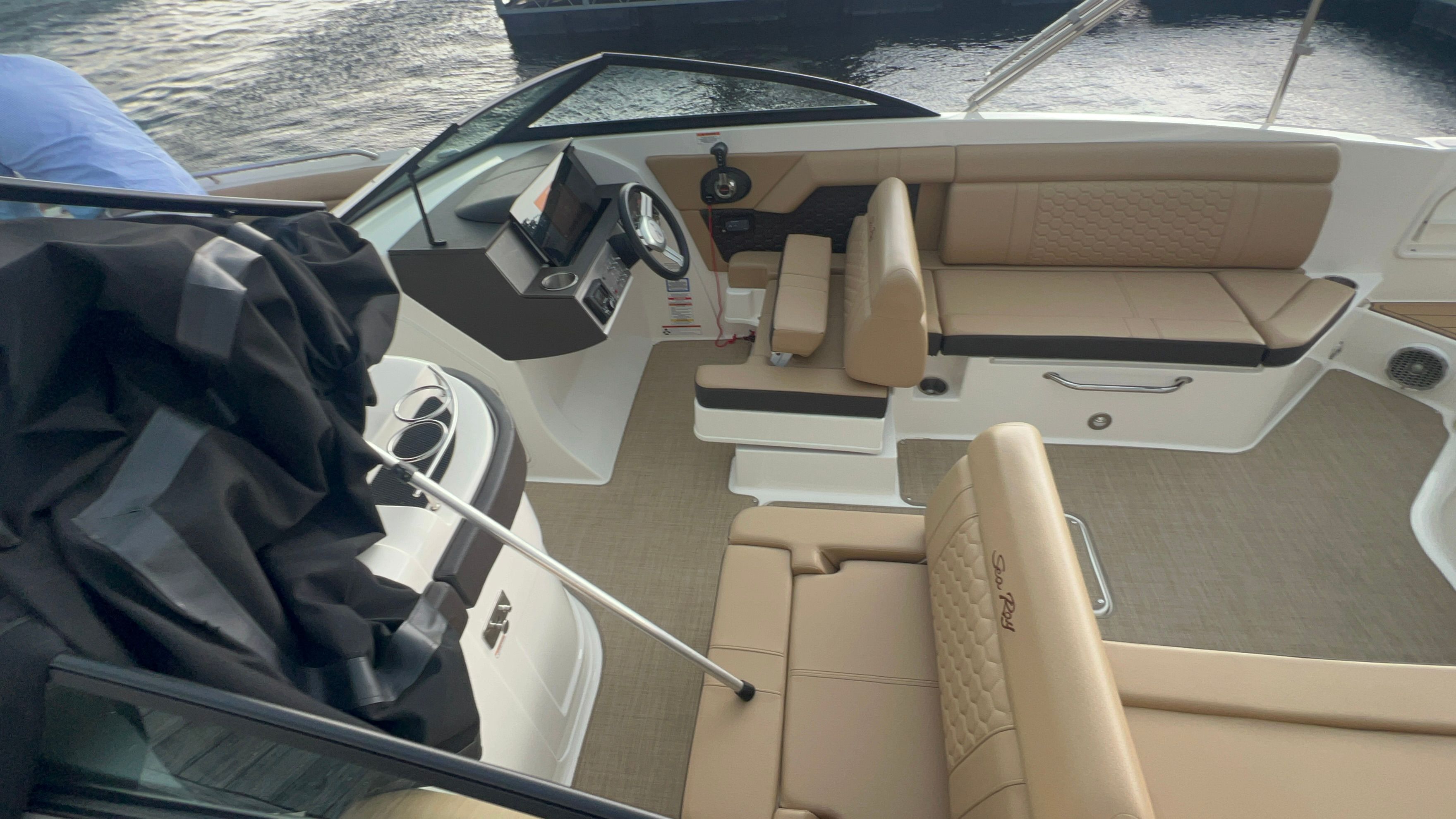 Interior of a 2018 Sea Ray SDX 270 with beige leather seating.