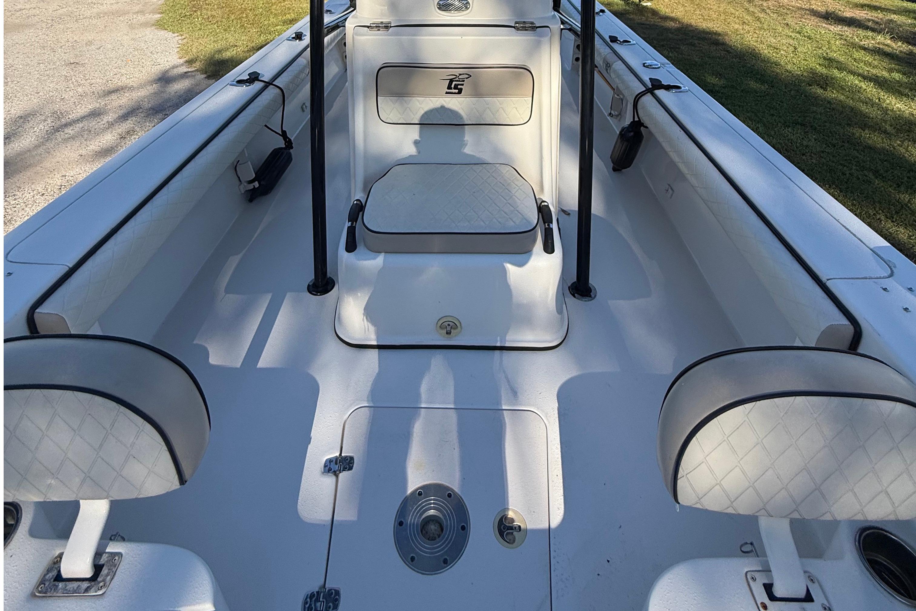 2021 Carolina Skiff 26 Ultra Elite boat interior with seating and storage compartments.