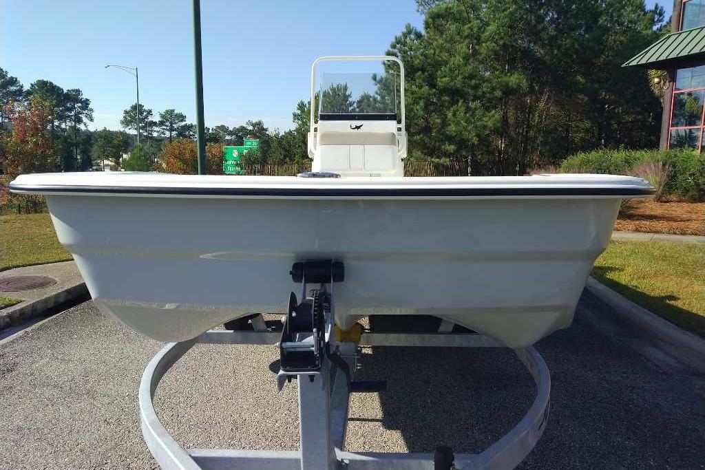 2026 Mako Pro Skiff 19 CC boat on trailer, parked outdoors.