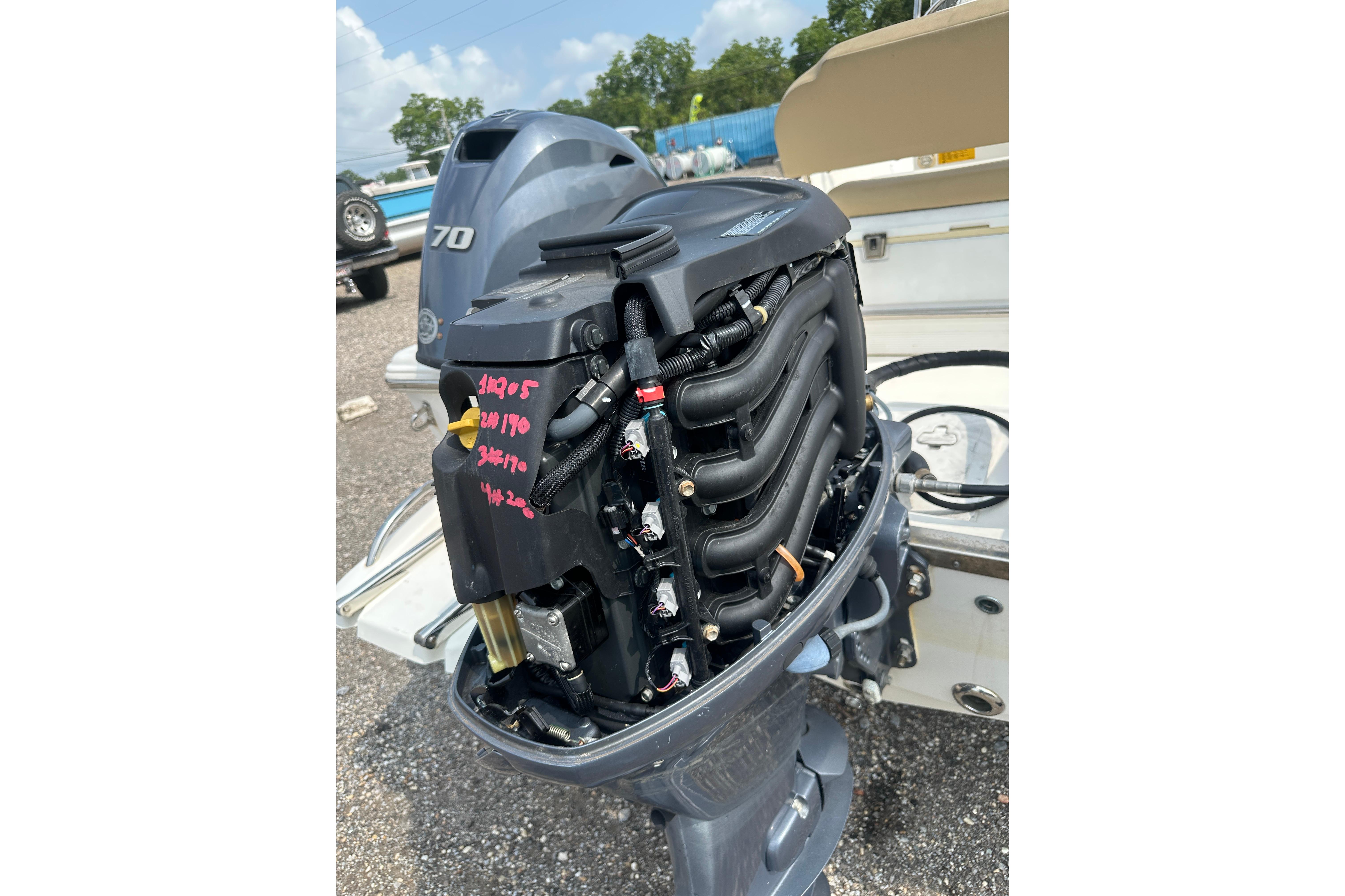 2018 Key West 1720 Center Console boat engine, detailed view of motor components.