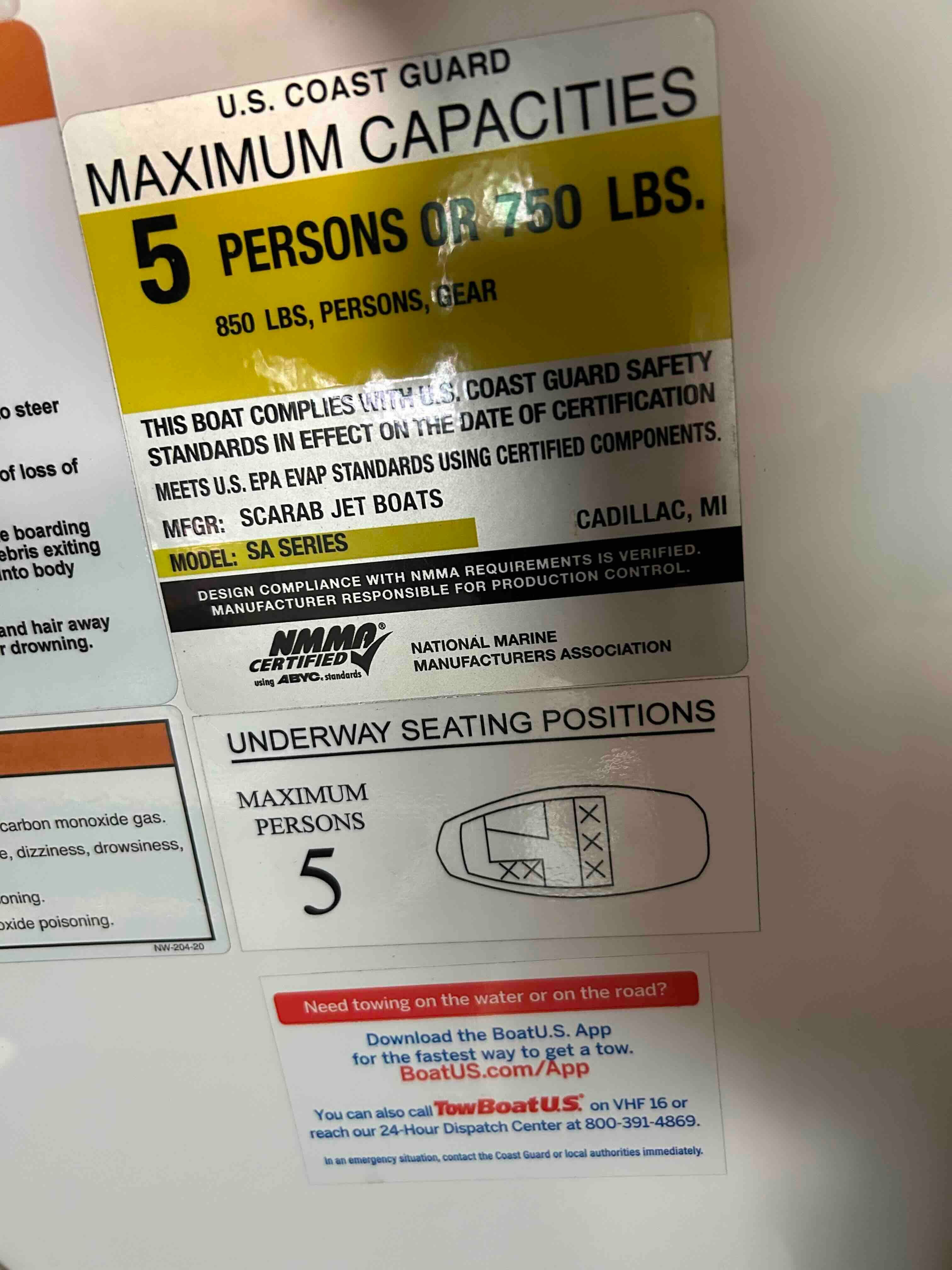 Safety label for a 2022 Scarab 165 ID boat, showing capacity details.