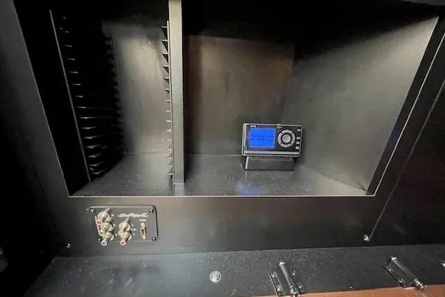 2016 Sea Ray Sundancer 510 interior electronics compartment with control panel and wiring.