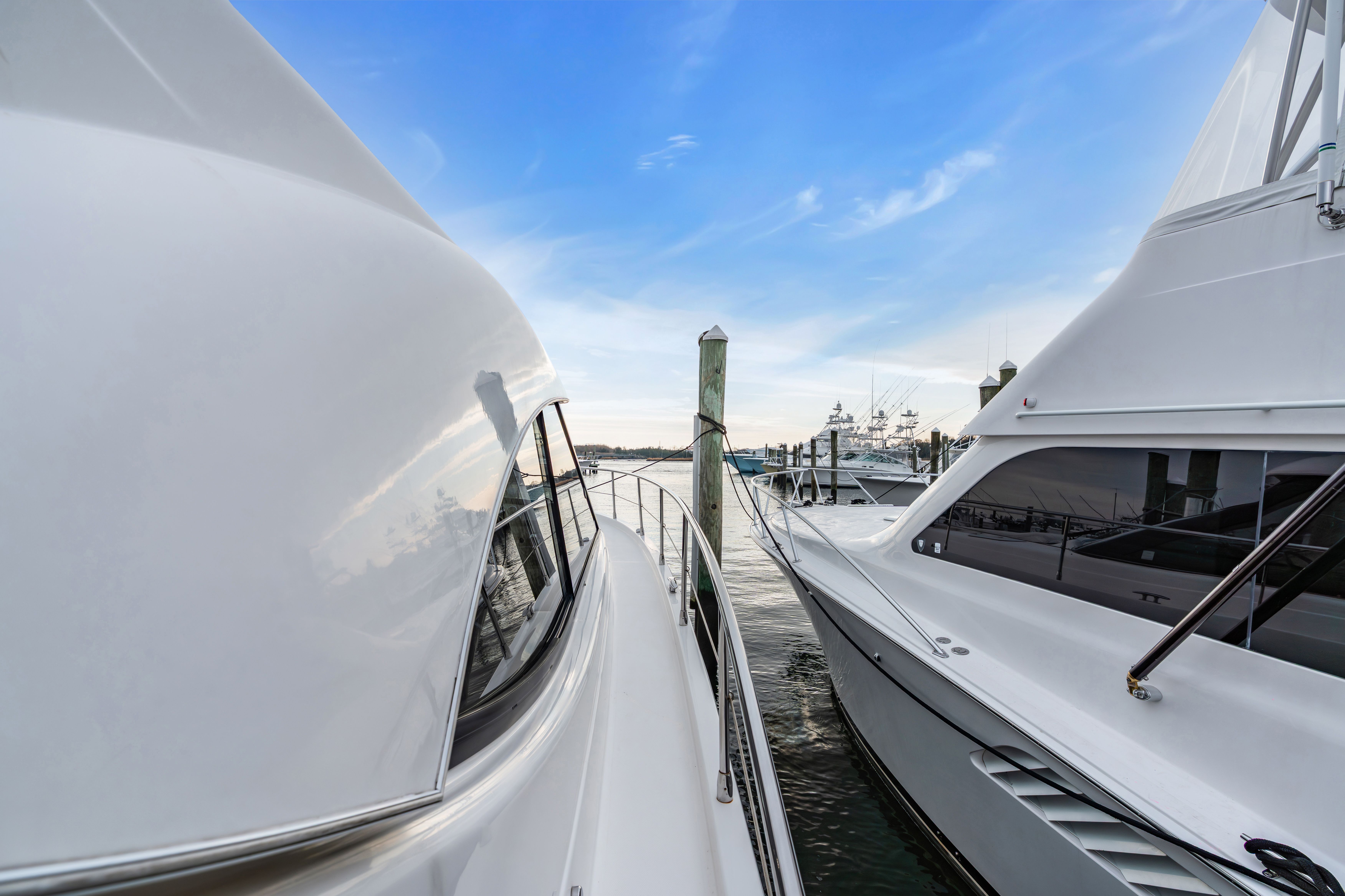 Riviera 44 Sport Yacht 2014 docked, blue sky.